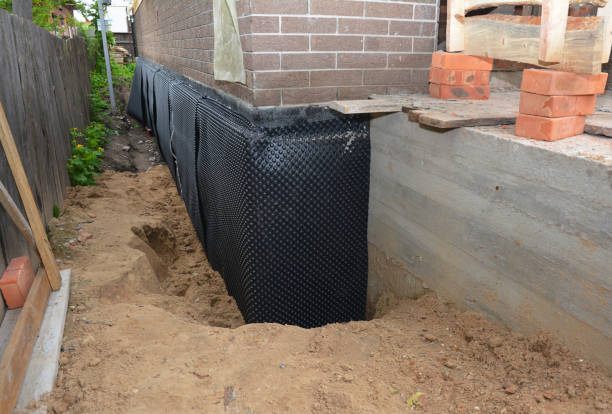 Happy homeowners after waterproofing job in Ludington
